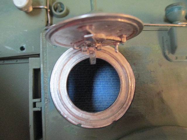 Ring and hatch mounted with interior locking handle in place