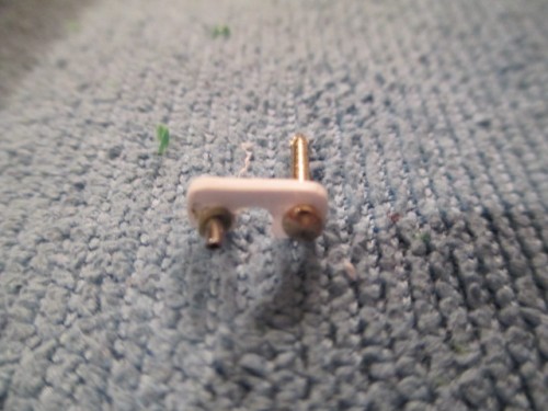 Locking plate with  brass pin for hinge and the mount for the Pistol Port Plug cable drilled out.