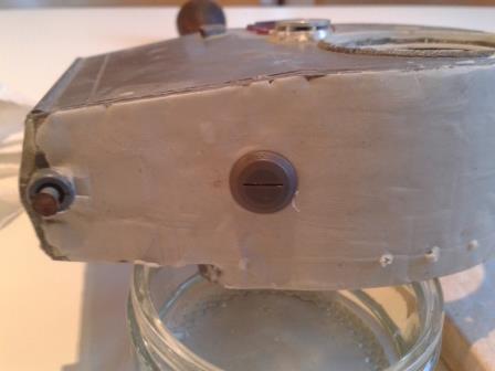 The Tamiya turret vision port was then pressed into the putty....jpg