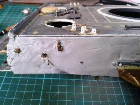 Using a pallet knife to smooth the putty helped to keep it even and work it wround the track cable brackets.jpg
