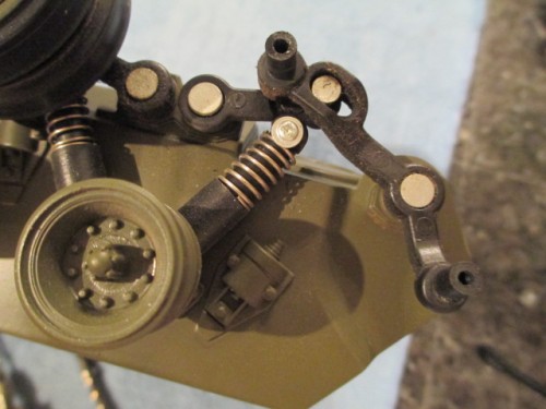 HL did a good job of mimicking the real suspension on the tank.  These pieces work just like the originals to move the idler and tighten the track in rough going.