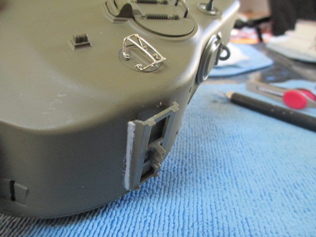 Schumo periscope guard bent to fit into the  drilled out bolt locations.