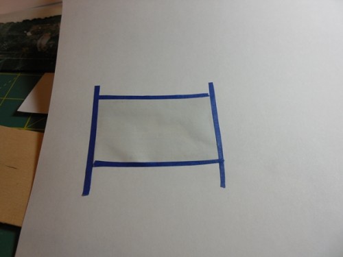 Paper taped down to run through the laser printer