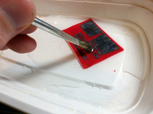 Stripping the plastic off the brass