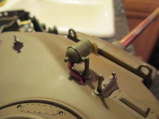 This required some sanding and gluing a Tamiya lens into place on a lengthened spot housing.   I got the spacer by cutting off the front of a spare spot housing.