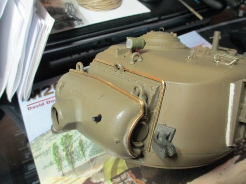 Careful bending and roughening of the brass aided in matching and gluing it to the mantlet