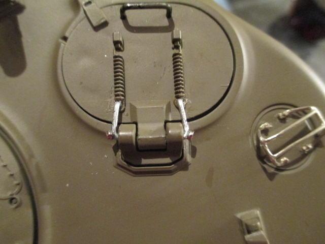 A couple of tiny crimp beads to act as nuts for the hinges