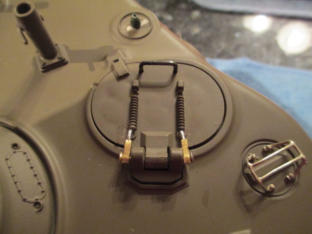 Working piston type sliding hinges give the hatch a better range of motion than the pins did and look more like the real thing.