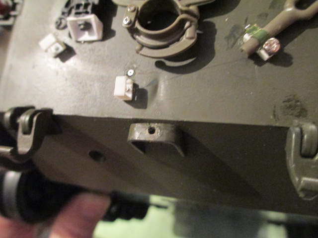Noted that the previously drilled tow hook mount hole was off center.  Plugged and redrilled for a better appearance.