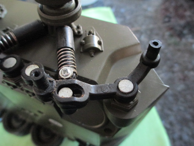 With a hardness like unto that of forged steel, these age hardened plastic suspension arms were very difficult to remove without damaging the rest of the lower hull.