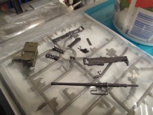 Pieces painted with Tamiya's Gunmetal spray with the mounts left in O.D.