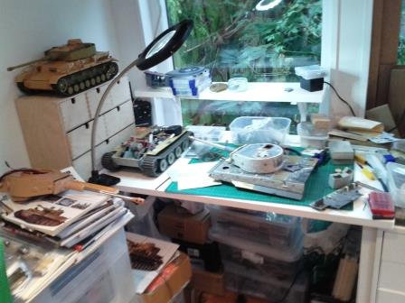 The Man Zone - controlled chaos with the HL Tiger on the work bench and a Tamiya Panzer IV patiently waiting it's turn.jpg