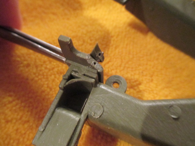 Broken trunnion mount tab drilled for a pin