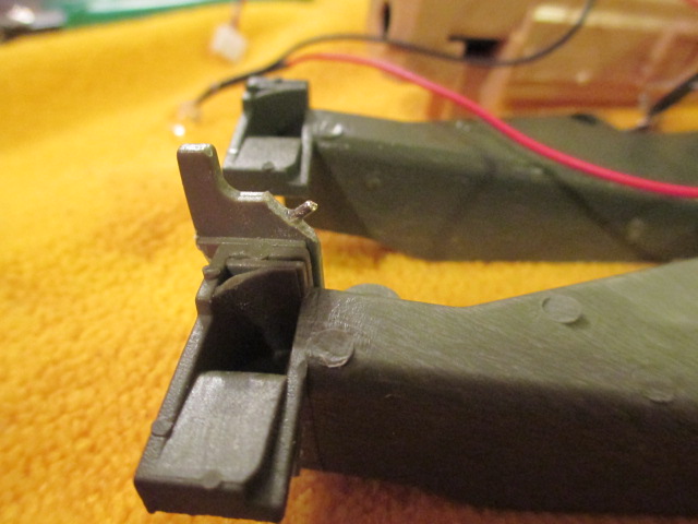 Pinned.  The repair worked but left some minor play in one side of the air gun mount.  A new ammo feed tray will be needed for a permanent repair.