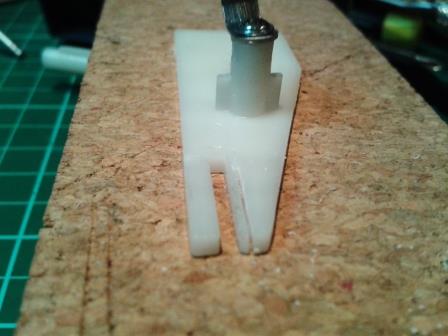 The resin elevation arm from the Taigen recoil unit was cut with a razor saw to a depth of about 2mm.jpg