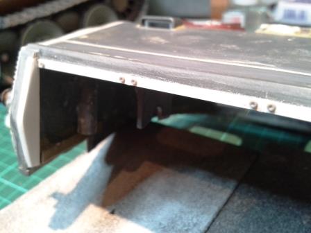 The square section plastic rod was fixed beneath the roof so that it stuck forward very slightly to give the illusion of the metal strips.jpg