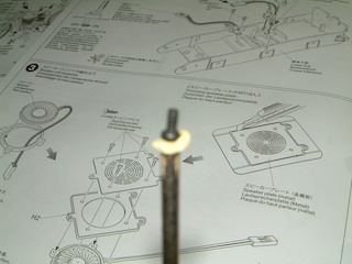 out of focus yellow blue tack for naughty screws