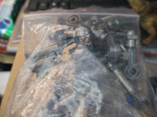 Metal and rubber road wheels, metal suspension components and metal track rollers and mounts.