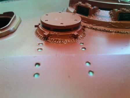 The armoured turret fan and gun travel lock retaining bolts.jpg