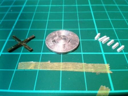 The underside of the armoured turret fan - original cross piece in brass on left, new plastic supports on right.jpg