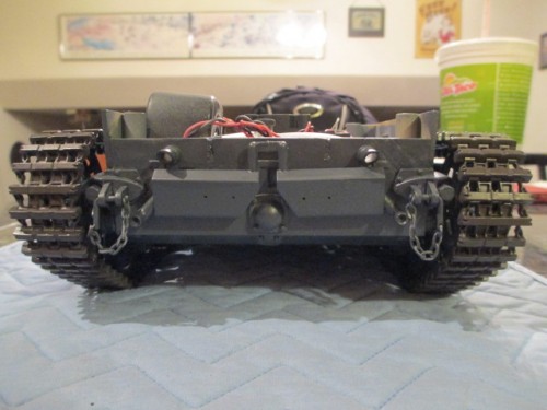 Idlers remounted and solid.  They free spin now without wiggle and the adjuster has gained smoother rebound.  Note the straightened lay of the tracks
