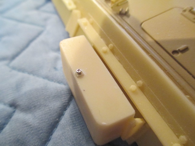 Once it is filed smooth, this screw will make a great knob for the cover there.