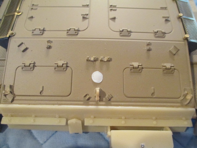 Using the Dremel and a bit for plastic, I opened up the mounts for the tow cables.