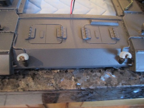 Working fix for the armored light buckets up front.  Silicone tubing split and glued so the buckets are held in place.