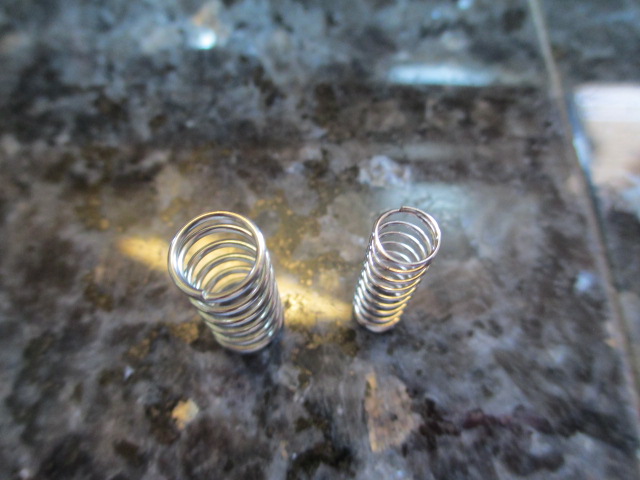 As noted by others, the replacement springs are far too large to fit in the shock housing.