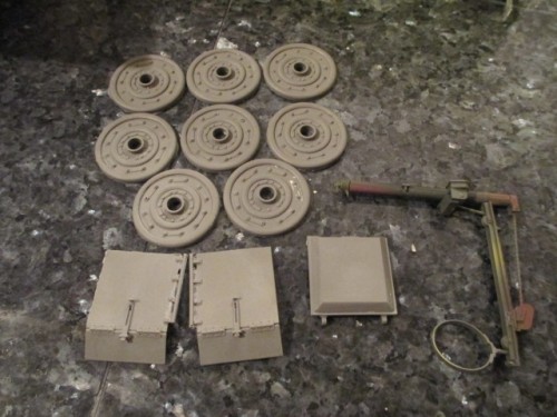 Examples of the hatch, road wheel inserts and fenders that come with the kit.