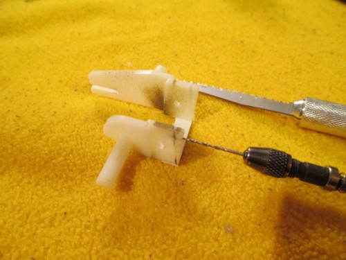 Holes for the steel pins drilled before the angle is cut into the arms