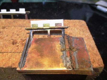 This way each hinge supports the other and all attach to the rear panel at once....jpg