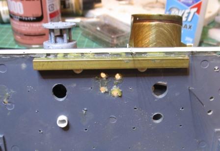 The original lower screw holes for the exhausts were enlarged to take the same plastic rod from the inside - the larger ones are for the smoke tubes.jpg