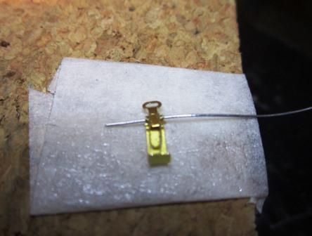 Using double-sided tape to hold everything in place was the only way I found to insert the wire through the clamp.jpg