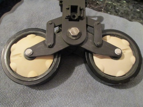 Bolts with spacers and tops filled with putty.  I may go to metal filler for more durability