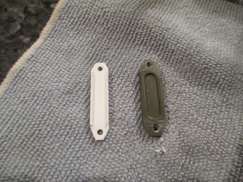 Roughed out interior brace alongside modified piece from a spare bogie.