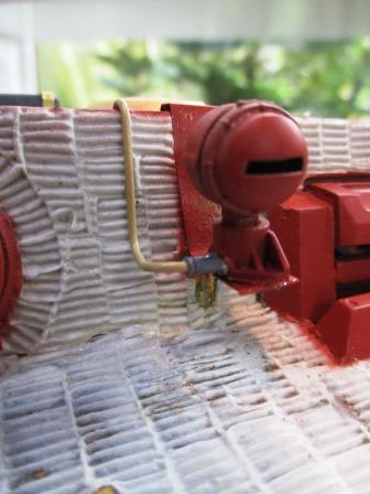 The headlight finished with cable conduit attached using a plug shaved off a Tamiya headlight bracket.jpg