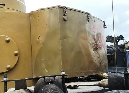A close-up shows the multiple shrapnel holes.jpg