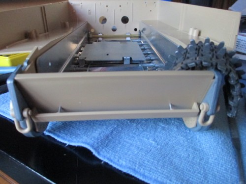 Bracket for the spare track mounted with a run of flexible nylon track set aside for it.  This won't be mounted until the lower hull is painted.