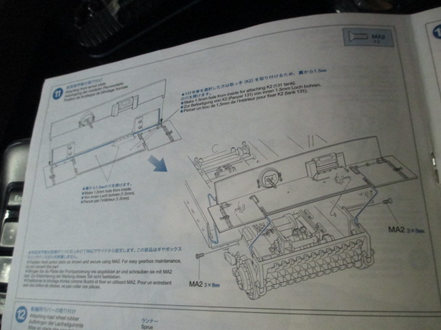 Step 11 requires mounting the bar and the section of track.  I eschewed the Tamiya molded segment and used a piece of live track off of a set of HLs'