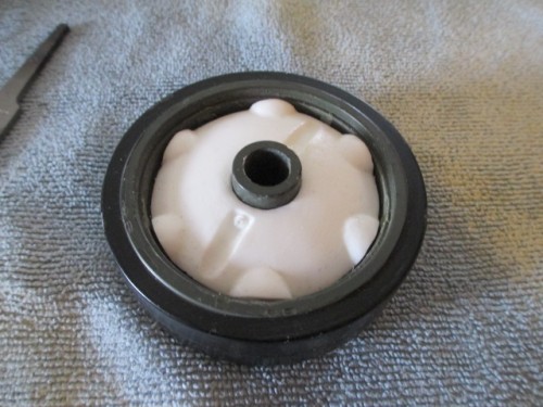 A lot of cleanup and some resin sanding later, I have a late war road wheel. ( The covers go on both sides )
