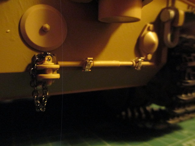Tow pintle chain pinned in place by one of the two previously mounted brass bolts