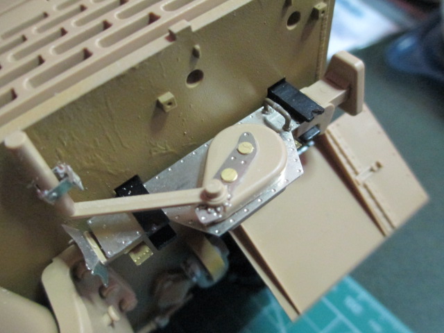 The Tamiya brackets edge was clipped and filed to accept a wingnut and rod