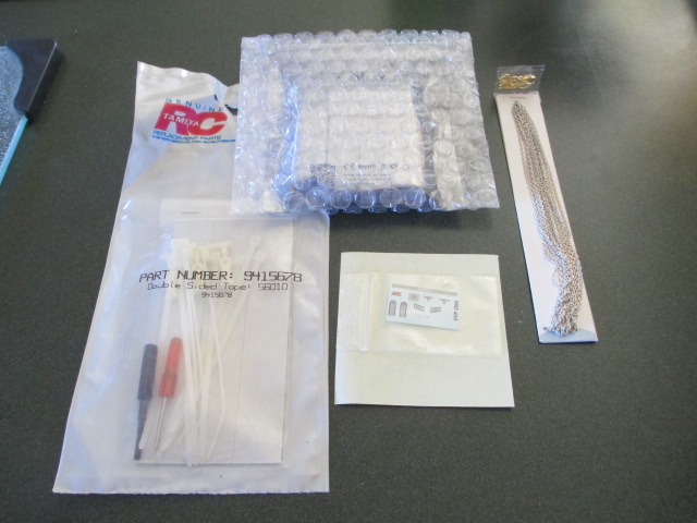 Tamiya parts from AAF, Chain from Mike.  Armor cabinet bulbs and a set of DAK Hauptmann's insignia for the Commander.