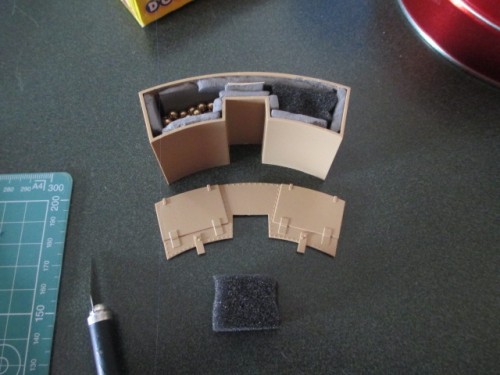 Here the box has the right amount of shot and little foam plugs have been cut to tamp the shot down before the cover goes on.