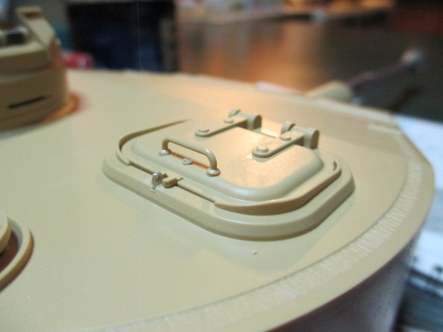 Outside hatch and rim showing lock hasp and key hole slide in place.