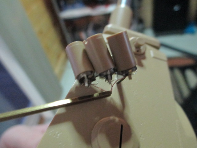 Feeding the wires into the brass.  For a moment I thought I had trimmed them off too short.