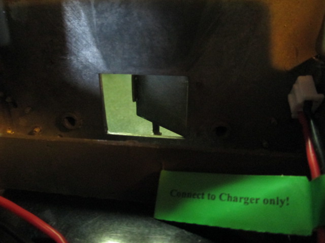 I epoxied on a small length of brass square and hand filed it into a latch.  The door snaps shut now and should remain secure during rough running.