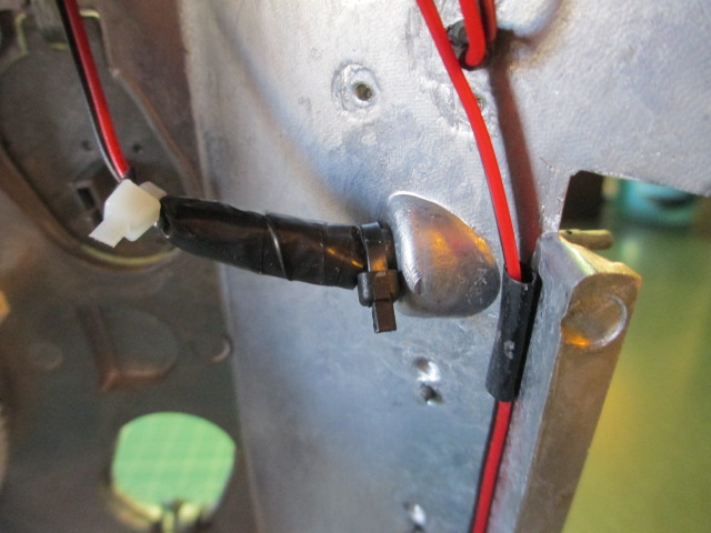 A quick way to cure a loose, metal MG.  Use a dot of gel cement and a wire tie as a spacer.