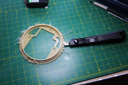 Trimming rim off one wheel to make flange for other